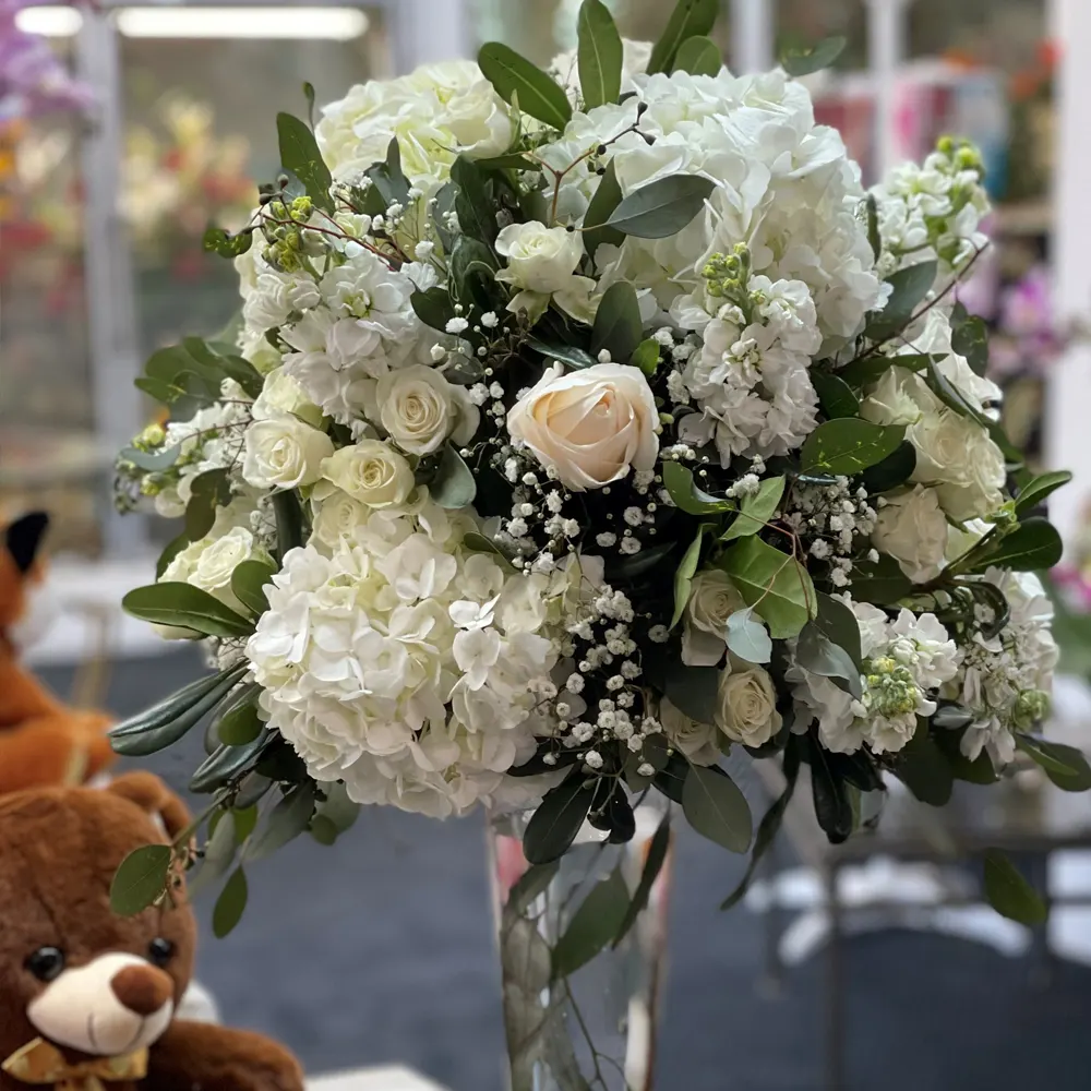White hydrangea and rose tall reception arrangement